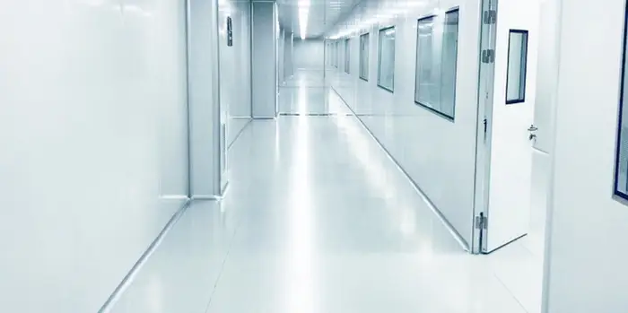 Cleanroom manufacturer team commissioning modular wall and ceiling system in aerospace facility
